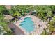 Take a look at this beautiful community pool with sun loungers and tropical landscaping at 6873 Slaven Dr, Orlando, FL 32819