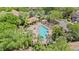 Aerial view of the gorgeous community pool, sun loungers, and manicured landscaping at 6873 Slaven Dr, Orlando, FL 32819