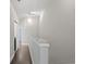 Upstairs hallway with hardwood floors and stylish banister at 6873 Slaven Dr, Orlando, FL 32819