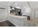 Spacious kitchen with a granite-topped island, stainless steel appliances, and a tiled backsplash at 6873 Slaven Dr, Orlando, FL 32819