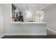 Bright kitchen with a large granite island, stylish pendant lighting, and dark cabinetry at 6873 Slaven Dr, Orlando, FL 32819