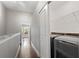 A laundry area with a washer and dryer tucked behind a sliding door at 6873 Slaven Dr, Orlando, FL 32819