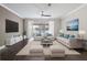 Bright living room with hardwood floors, neutral paint, and modern furnishings at 6873 Slaven Dr, Orlando, FL 32819