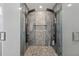 Modern walk-in shower featuring dual shower heads and mosaic tile at 6873 Slaven Dr, Orlando, FL 32819