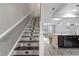 Staircase leads to the second story with beautiful tile work and accents at 6873 Slaven Dr, Orlando, FL 32819