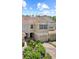 Charming two-story townhouse with a tile roof, single car garage, and manicured landscaping in front at 6873 Slaven Dr, Orlando, FL 32819