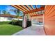 This backyard features a pergola, a pool with metal fencing, and nice greenery at 7422 Sparkling Ct, Reunion, FL 34747