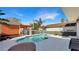 Inviting backyard features a sparkling pool, spa, and covered patio area for relaxation at 7422 Sparkling Ct, Reunion, FL 34747