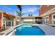 Beautiful backyard pool with seating areas and lush landscaping, ideal for entertaining at 7422 Sparkling Ct, Reunion, FL 34747