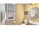 Half bathroom features a modern sink and fixtures and a large window at 7422 Sparkling Ct, Reunion, FL 34747