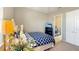 Bedroom with neutral paint, carpeting, tv, and access to the laundry room at 7422 Sparkling Ct, Reunion, FL 34747