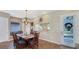 Inviting dining area with a chandelier, large table, and easy access to the kitchen and outdoor areas at 7422 Sparkling Ct, Reunion, FL 34747
