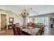 Dining room with a view into the living room and backyard at 7422 Sparkling Ct, Reunion, FL 34747