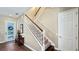 Inviting entryway featuring a staircase, tile flooring, and a decorative front door with sidelights at 7422 Sparkling Ct, Reunion, FL 34747