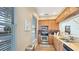 Well-lit kitchen featuring wood cabinets, stainless steel appliances, and ample counter space at 7422 Sparkling Ct, Reunion, FL 34747