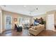 Cozy living room with tile floors, comfortable seating, and plenty of natural light at 7422 Sparkling Ct, Reunion, FL 34747
