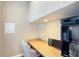 Cozy office space featuring a built-in desk, neutral colors, and sufficient lighting at 7422 Sparkling Ct, Reunion, FL 34747