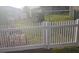 A view of the backyard featuring a white picket fence and a stack of bricks at 773 Leopard Ct, Kissimmee, FL 34759