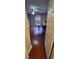 A view of a bedroom from the door featuring hardwood floors, a ceiling fan, and a window at 773 Leopard Ct, Kissimmee, FL 34759