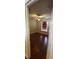 Inviting bedroom features hardwood flooring, natural light from the window, and a ceiling fan for optimal comfort at 773 Leopard Ct, Kissimmee, FL 34759