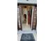 Inviting entryway featuring tile flooring, a decorative rug, and a staircase leading to the upper level at 773 Leopard Ct, Kissimmee, FL 34759