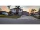 Charming two-story home with a well-maintained yard and mature palm trees, featuring a spacious driveway and attached garage at 773 Leopard Ct, Kissimmee, FL 34759