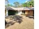 Charming single-story home with well-maintained lawn and unique architectural details at 805 Hemlock Dr, Apopka, FL 32712