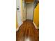 Hallway with white trim and solid hardwood flooring in a home at 805 Hemlock Dr, Apopka, FL 32712