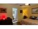 Well-lit main bedroom with a neutral color scheme, bathroom access and traditional decor at 805 Hemlock Dr, Apopka, FL 32712
