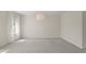 Bright, spacious bedroom with large window dressed with sheer white curtains at 8724 Peachtree Park Ct, Windermere, FL 34786