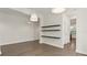 Open dining room area features three-tiered floating shelves and hardwood flooring at 8724 Peachtree Park Ct, Windermere, FL 34786