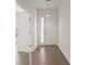 Bright entryway with wood floors and a glass-paneled front door at 8724 Peachtree Park Ct, Windermere, FL 34786