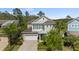 Inviting two-story home with a two-car garage and charming landscaping at 8724 Peachtree Park Ct, Windermere, FL 34786