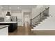 Open kitchen and staircase provide an inviting entry to this modern home at 8724 Peachtree Park Ct, Windermere, FL 34786