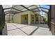 Spacious screened patio with ample room for seating and outdoor activities at 8724 Peachtree Park Ct, Windermere, FL 34786