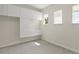 This walk-in closet features built-in white cabinetry, lots of natural light, and neutral carpeting at 8724 Peachtree Park Ct, Windermere, FL 34786