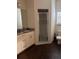 Modern bathroom with sleek vanity, granite countertop, and a walk-in shower at 8981 Shine Dr, Kissimmee, FL 34747
