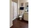 Bathroom featuring a shower with curtain, wood look floor and granite counters at 8981 Shine Dr, Kissimmee, FL 34747
