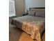 Cozy bedroom with a comfortable bed, carpet, and natural light at 8981 Shine Dr, Kissimmee, FL 34747