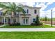 Charming two-story townhome with a well-maintained lawn, fresh landscaping, and neutral siding at 8981 Shine Dr, Kissimmee, FL 34747