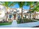 Inviting two-story townhome with well-manicured lawn, landscaping, and neutral siding at 8981 Shine Dr, Kissimmee, FL 34747