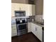 Modern kitchen featuring stainless steel appliances and stylish cabinetry at 8981 Shine Dr, Kissimmee, FL 34747