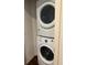 A convenient, stacked washer and dryer set, perfect for efficient laundry days and saving space at 8981 Shine Dr, Kissimmee, FL 34747