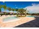 Resort-style pool with pergola-covered lounge areas, palm trees, and ample seating at 8981 Shine Dr, Kissimmee, FL 34747