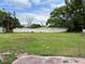 Large, flat backyard enclosed with an updated privacy fence at 921 Louisiana Ave, St Cloud, FL 34769
