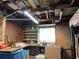 Unfinished basement with pegboard walls, a workbench, and shelving offering potential for customization and storage at 921 Louisiana Ave, St Cloud, FL 34769