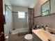 Functional bathroom featuring a bathtub, a shower, a sink with toiletries, and a mirror at 921 Louisiana Ave, St Cloud, FL 34769