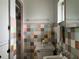 Retro bathroom with colorful tile work, vintage fixtures, and bright lighting at 921 Louisiana Ave, St Cloud, FL 34769
