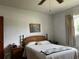 Cozy bedroom featuring a comfortable bed, side tables, and a decorative wall painting, creating a peaceful retreat at 921 Louisiana Ave, St Cloud, FL 34769