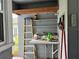 Outdoor sink with adjacent ladder and storage shelves at 921 Louisiana Ave, St Cloud, FL 34769